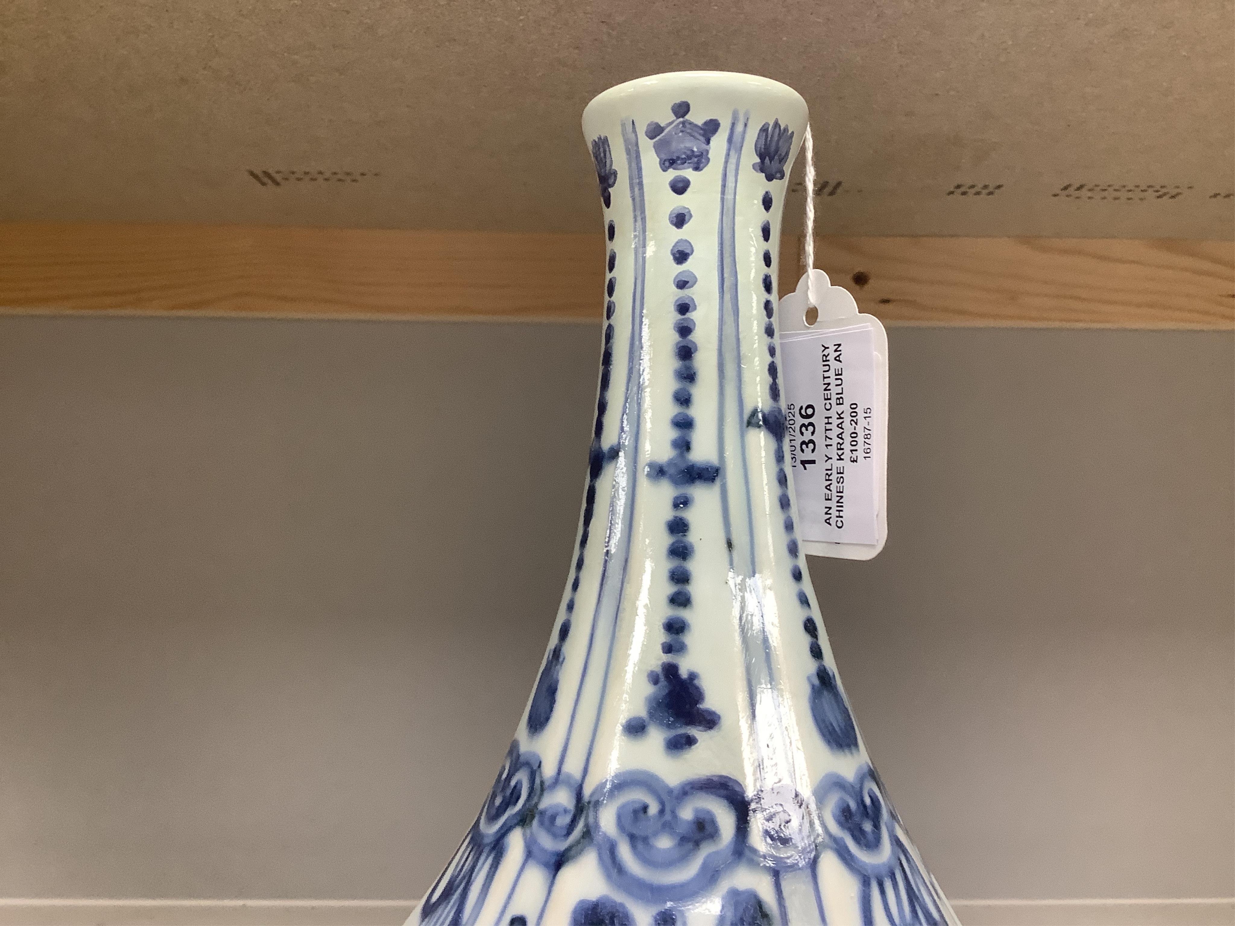 An early 17th century Chinese kraak blue and white bottle vase, 28.5cm. Condition - restored